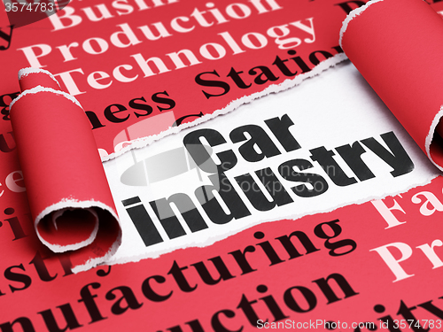 Image of Manufacuring concept: black text Car Industry under the piece of  torn paper