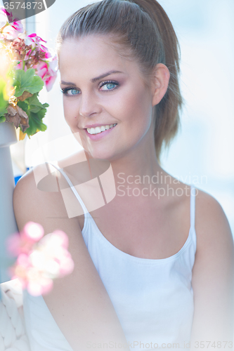 Image of Beautiful young woman in summer sunshine