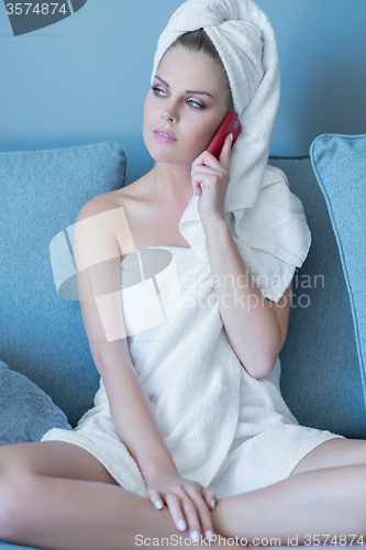 Image of Woman in Bath Towel Talking on Cell Phone