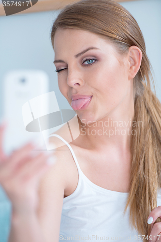 Image of Young woman pulling a face for selfie