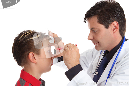 Image of Doctor checking patient eyes