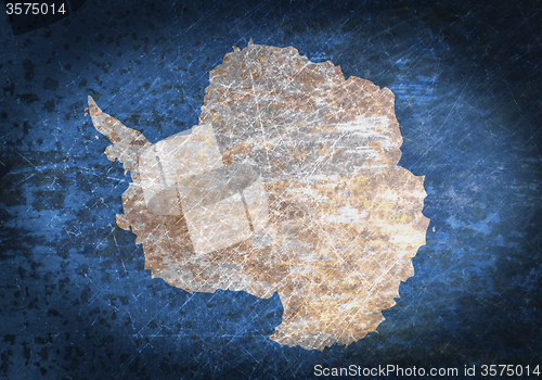 Image of Old rusty metal sign with a flag