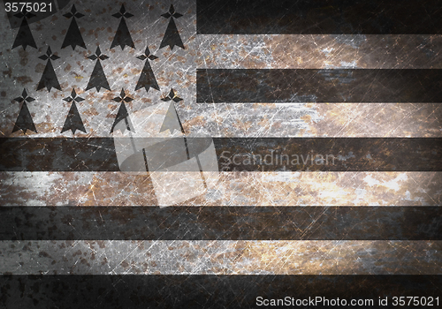 Image of Old rusty metal sign with a flag