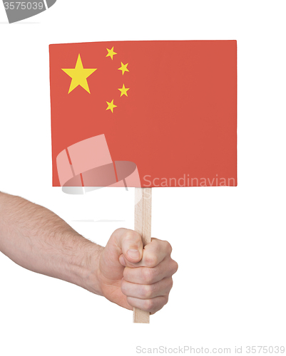 Image of Hand holding small card - Flag of China