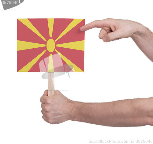 Image of Hand holding small card - Flag of Macedonia
