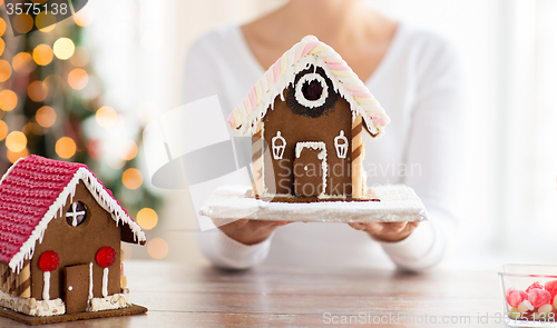 Image of close up of woman showing gingerbread house