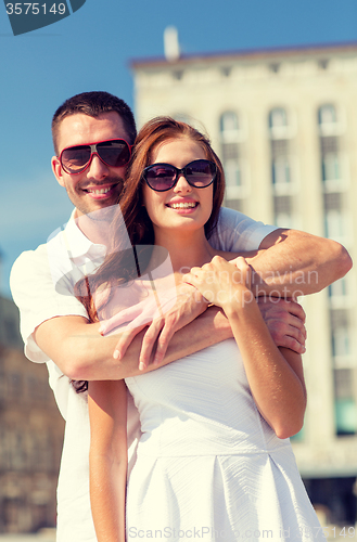 Image of smiling couple in city