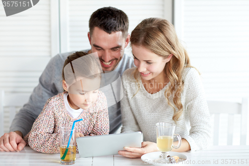 Image of happy family with tablet pc at restaurant