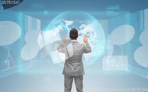 Image of businessman working with virtual screen