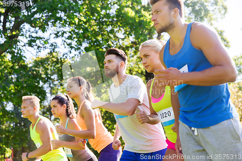 Image of sportsmen with badge numbers on start of race