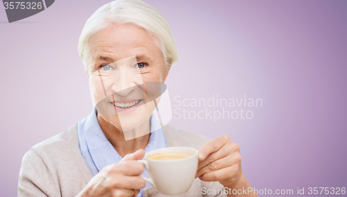 Image of happy senior woman with cup of coffee