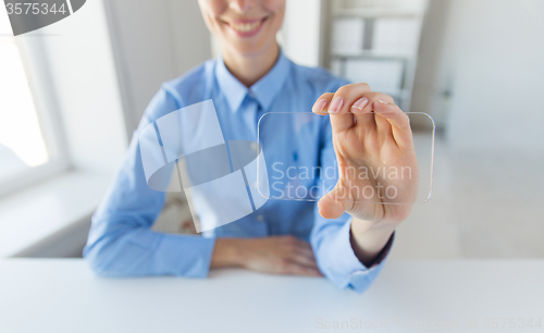 Image of close up of woman with transparent smartphone