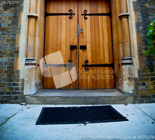 Image of wooden parliament in london old church door and marble antique  