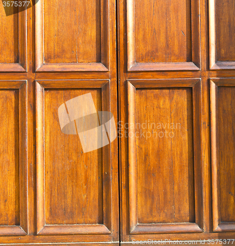 Image of  in mozzate rusty    door curch  closed metal wood   lombardy   