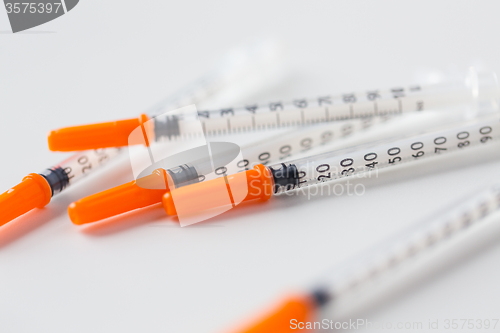 Image of close up of insulin syringes on table