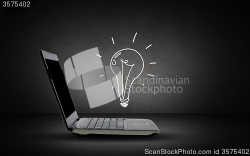 Image of open laptop computer with lighting bulb doodle