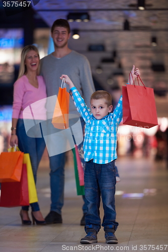 Image of young family with shopping bags