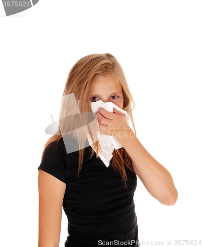 Image of Little girl blowing her nose.