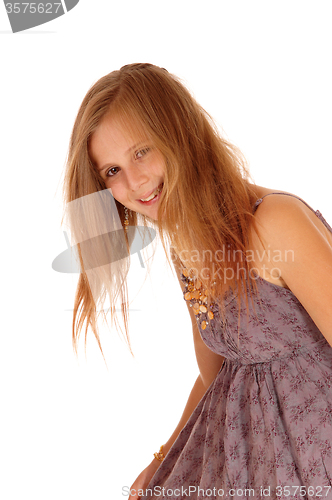 Image of Smiling little girl bending down.