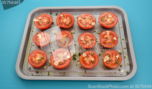 Image of Tomatoes on a baking tray ready for roasting