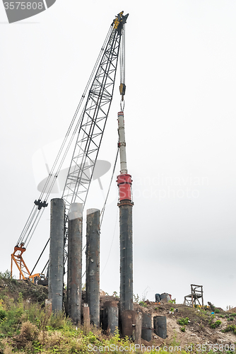 Image of Pile driving machine on construction site. Tyumen