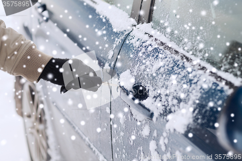 Image of close up of man with car key outdoors