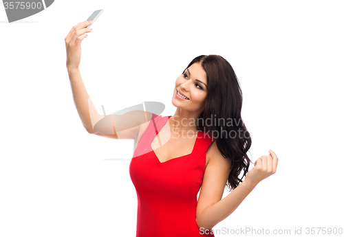 Image of sexy woman taking selfie picture by smartphone