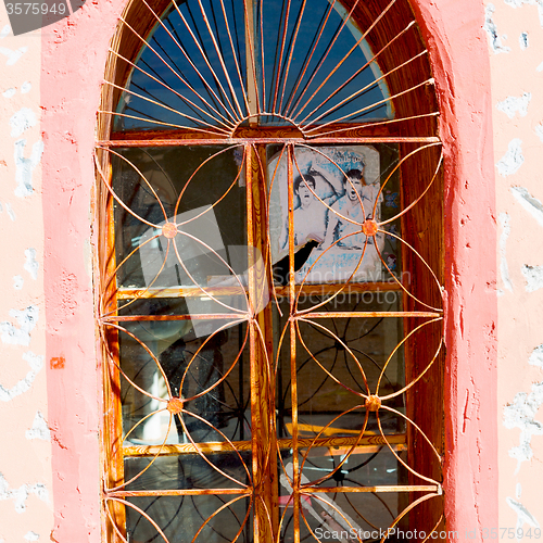 Image of   window in morocco africa old construction and brown wall  