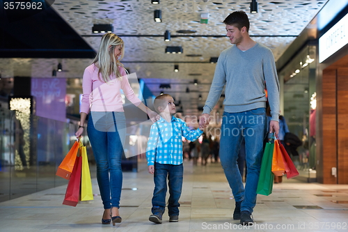 Image of young family with shopping bags