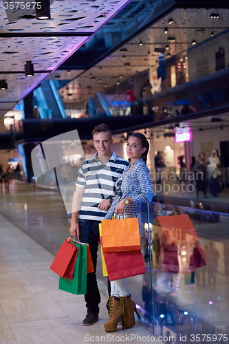 Image of young couple with shipping bags
