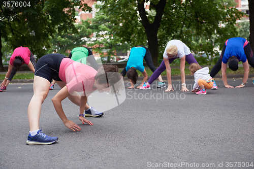 Image of jogging people group stretching
