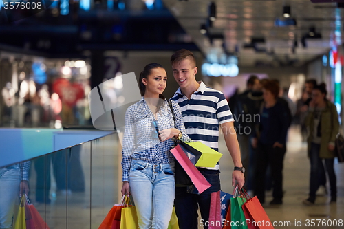Image of young couple with shipping bags