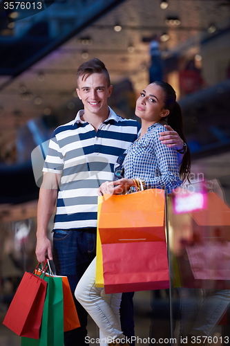 Image of young couple with shipping bags