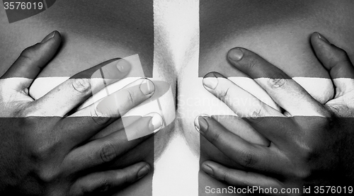 Image of Hands covering breasts