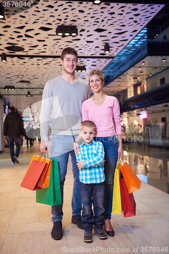 Image of young family with shopping bags