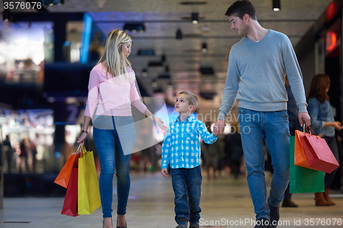 Image of young family with shopping bags