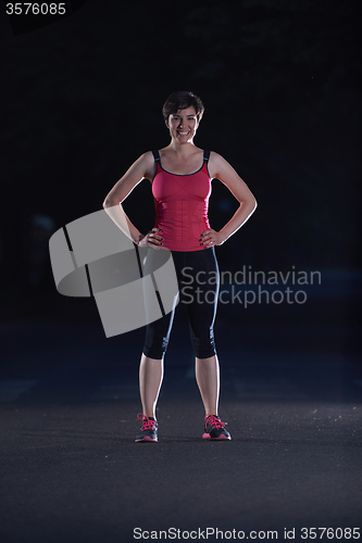 Image of woman  stretching before morning jogging