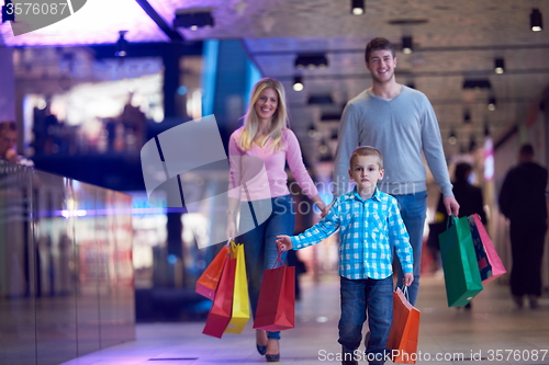 Image of young family with shopping bags