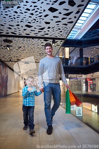 Image of young family with shopping bags