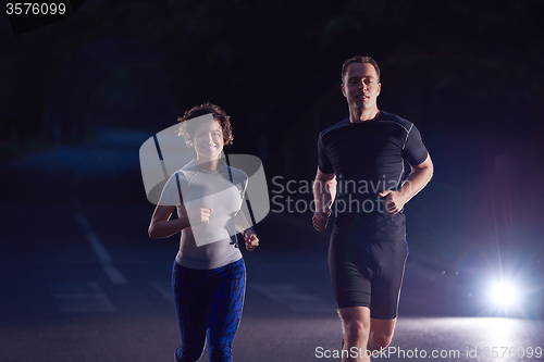 Image of couple jogging at early morning