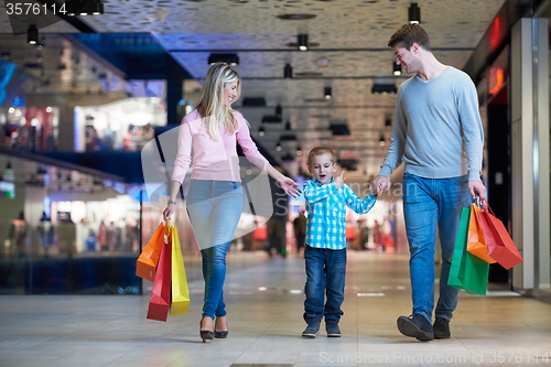 Image of young family with shopping bags