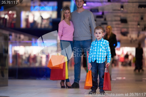 Image of young family with shopping bags