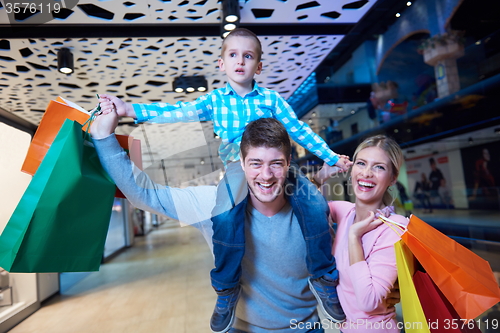 Image of young family with shopping bags