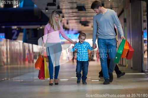 Image of young family with shopping bags