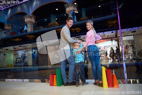 Image of young family with shopping bags