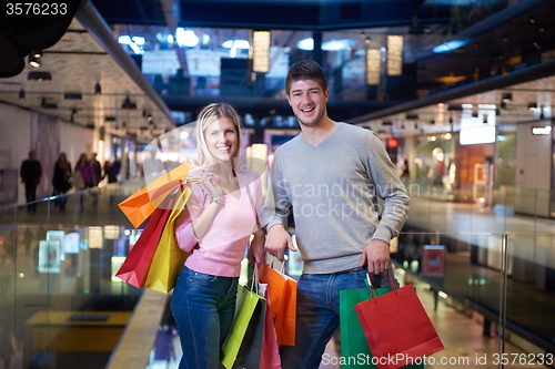 Image of young couple with shipping bags