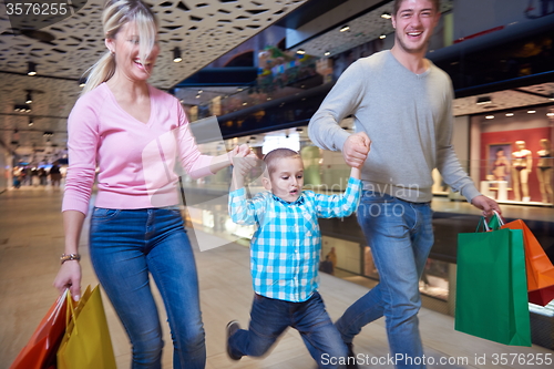 Image of young family with shopping bags