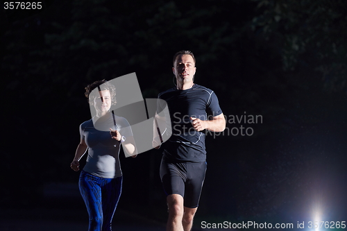 Image of couple jogging at early morning