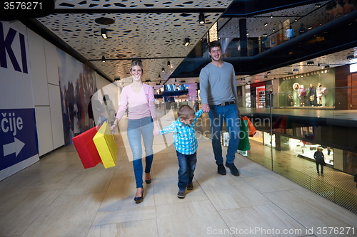 Image of young family with shopping bags