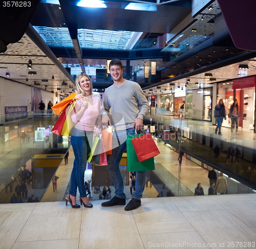 Image of young couple with shipping bags